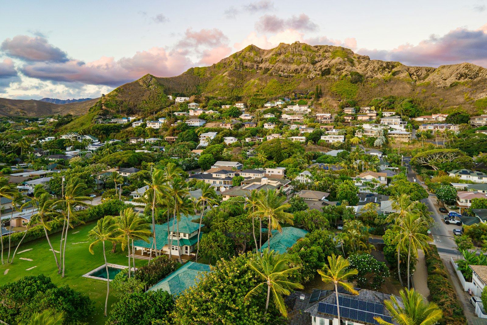 Homes among mature landscaping below a ridgeline in Kailua, on the windward side of Oahu
